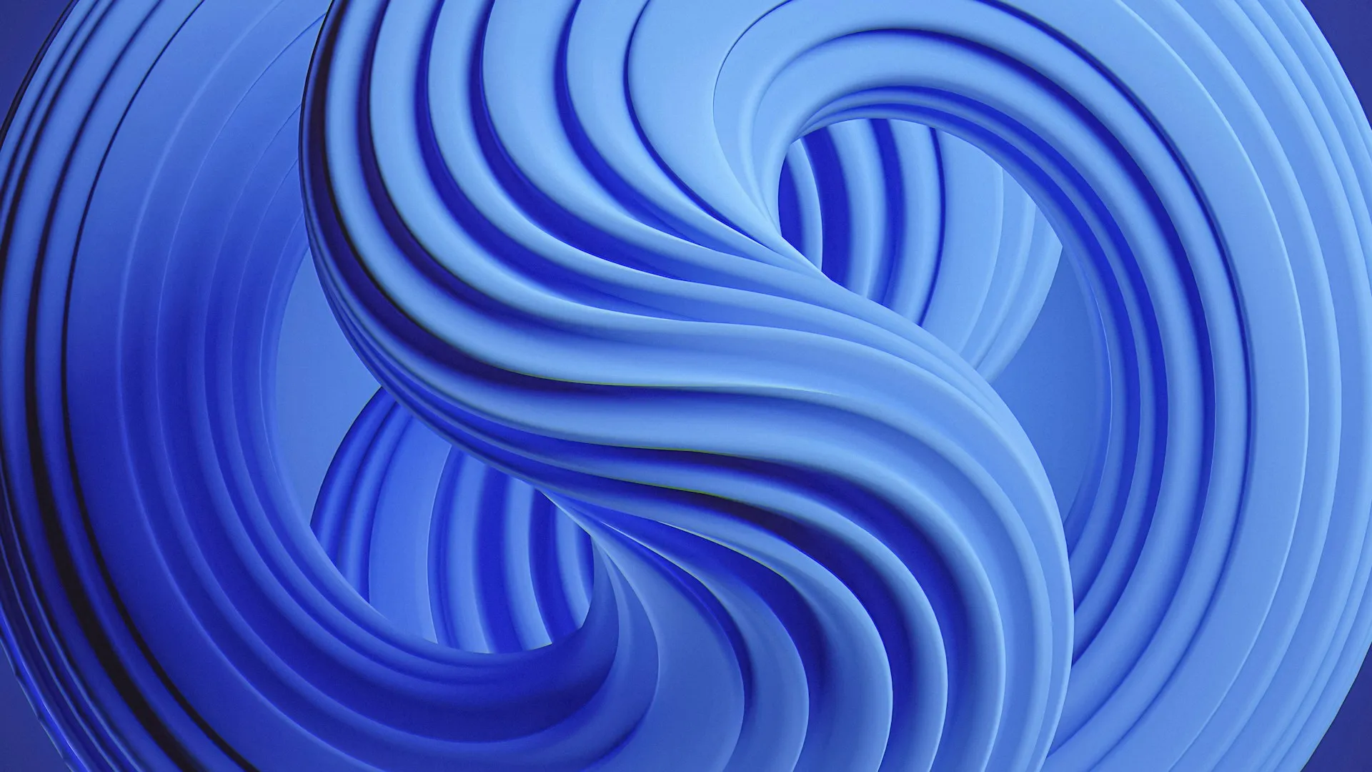 An abstract blue object, with swirling, circular yin-yang pattern.