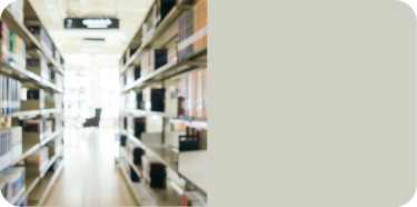A passageway between two shelves full of books.
